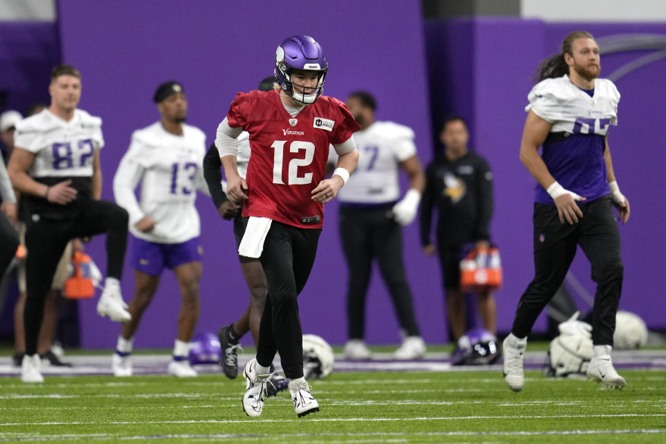 Minnesota Vikings quarterback Nick Mullens (12) takes part in drills during NFL football practice in Eagan, Minn., Monday, Dec. 4, 2023. (AP Photo/Abbie Parr)