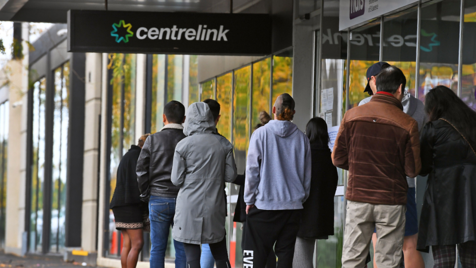 People line up outside a Centrelink office.