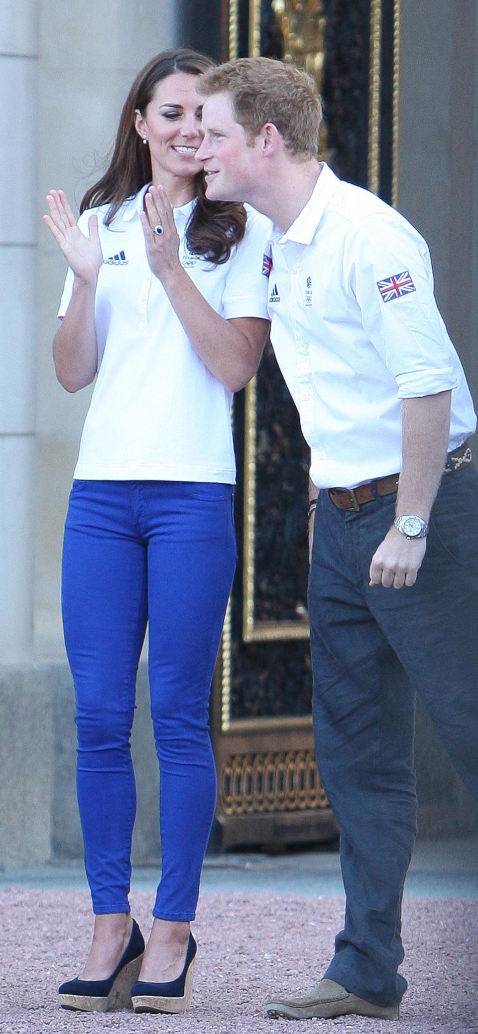 Catherine, Duchess of Cambridge aka Kate Middleton and Prince Harry welcome the Olympic Flame to Buckingham Palace during the Olympic Torch Relay London, England - 26.07.12 Credit Mandatory: WENN.com