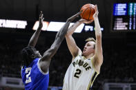 Purdue guard Fletcher Loyer (2) shoots over New Orleans guard K'mani Doughty (2) during the second half of an NCAA college basketball game in West Lafayette, Ind., Wednesday, Dec. 21, 2022. (AP Photo/Michael Conroy)