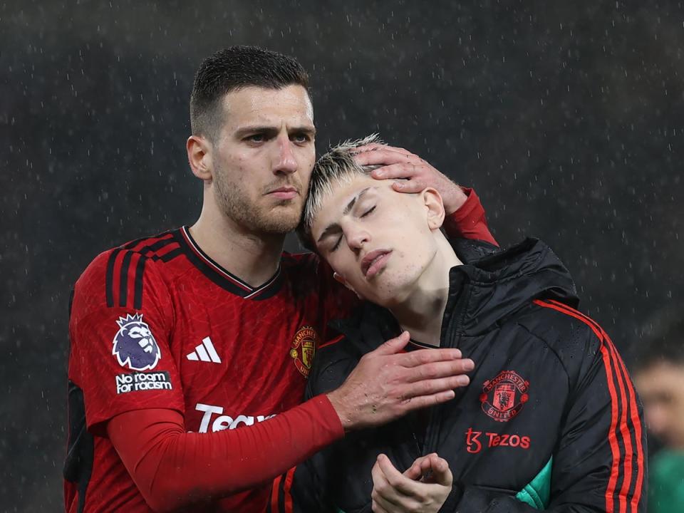 Diogo Dalot, Alejandro Garnacho of Manchester United walks off after defeat to Chelsea (Manchester United via Getty Imag)
