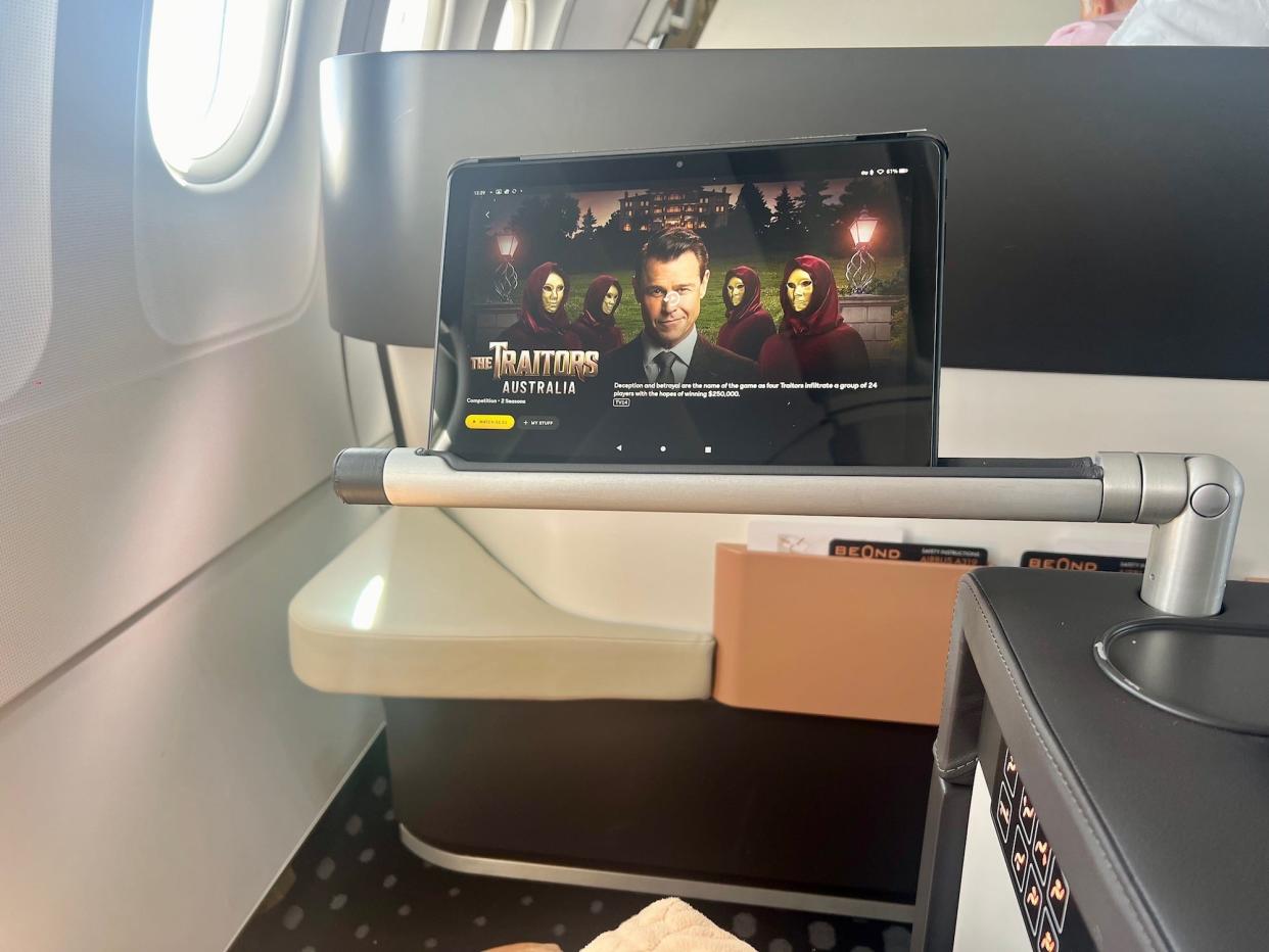 The author's Kindle Fire 10 on the tablet holder in front of the seat.