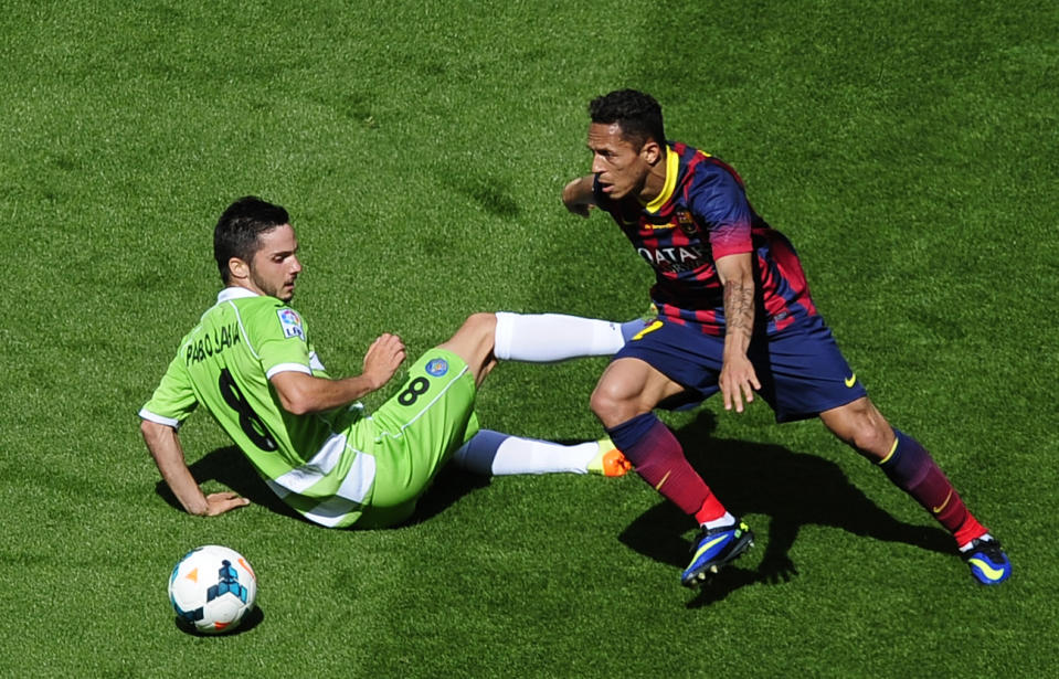 FC Barcelona's Adriano, from Brazil, right, duels for the ball against Getafe's Pablo Sarabia during a Spanish La Liga soccer match at the Camp Nou stadium in Barcelona, Spain, Saturday, May 3, 2014. (AP Photo/Manu Fernandez)