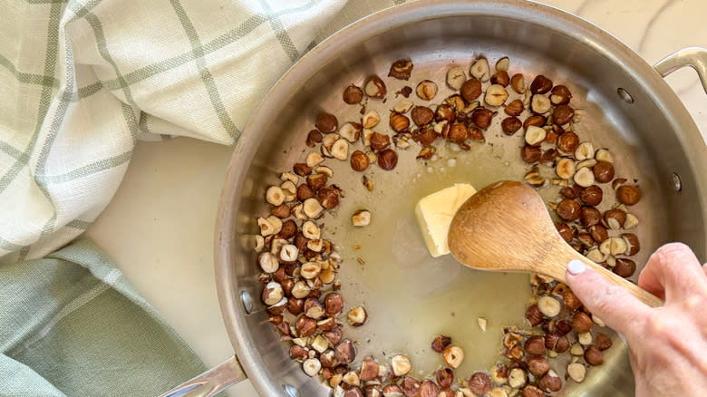 butter in pan with nuts