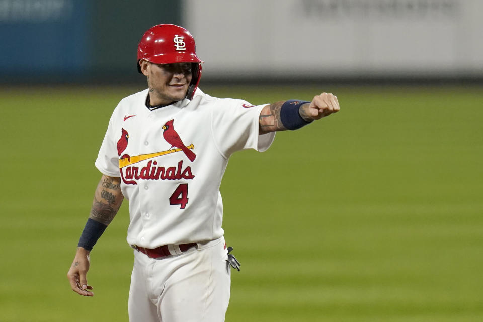 St. Louis Cardinals' Yadier Molina celebrates after hitting a single for his 2,000th career hit during the seventh inning of a baseball game against the Milwaukee Brewers Thursday, Sept. 24, 2020, in St. Louis. (AP Photo/Jeff Roberson)