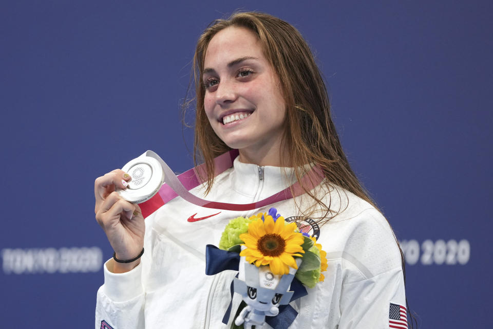 Emma Weyant, of United States, poses with her silver medal on the podium for the women's 400-meter Individual medley at the 2020 Summer Olympics, Sunday, July 25, 2021, in Tokyo, Japan. (AP Photo/Matthias Schrader)