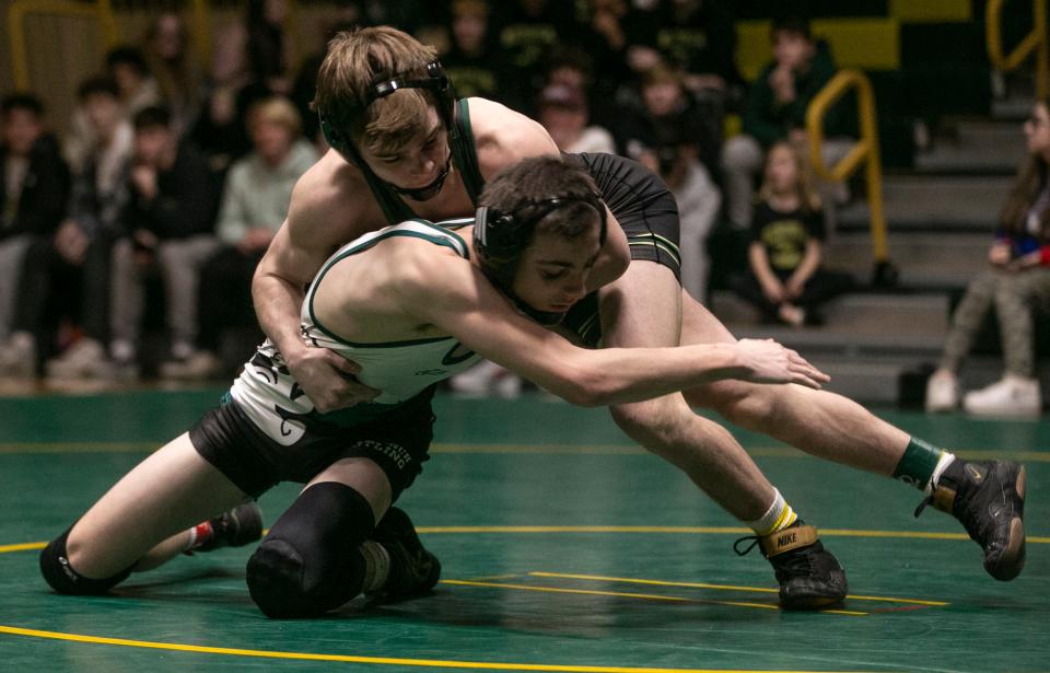 Brick Memorial's Anthony Santaniello (facing the camera) pinned Nick Miller in the Mustangs' 39-30 win over Long Branch Monday night in a NJSIAA Central Group 4 semifinal.