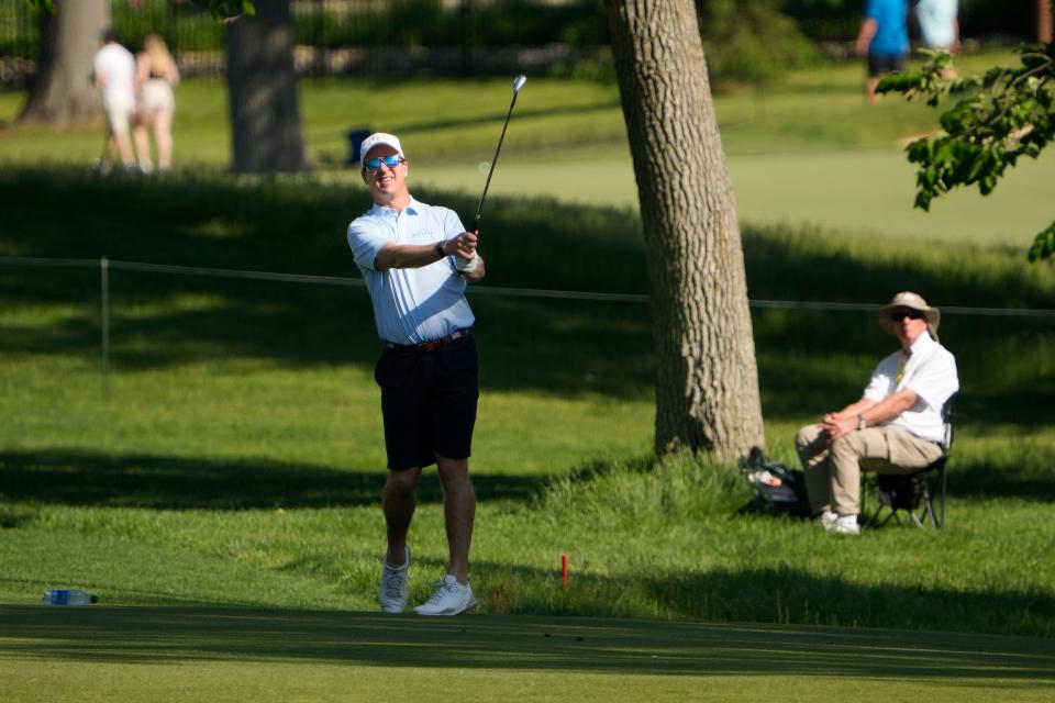 May 31, 2023; Dublin, Ohio, USA;  Peyton Manning hits from the 14th fairway during the Workday Golden Bear Pro Am at the Memorial Tournament at Muirlfield Village Golf Club. 