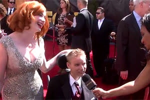 Christina Hendricks, left, with Make-A-Wish recipient David, center