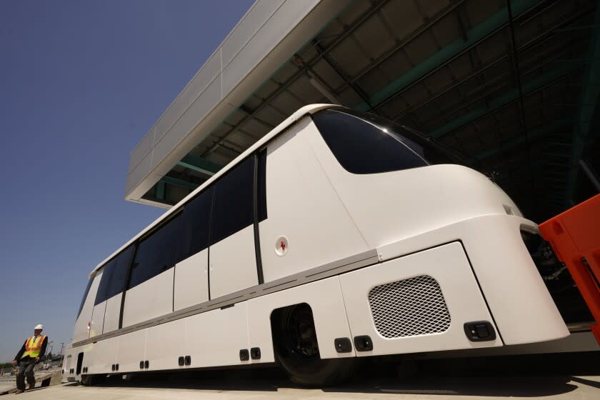 The new Automated People Mover (APM) train car is unveil at Los Angeles International Airport (LAX) on Tuesday, Aug. 2, 2022. The Automated People Mover (APM) is an electric train system on a 2.25-mile elevated guideway with six stations total, three inside the Central Terminal Area (CTA) and three outside the CTA. (AP Photo/Damian Dovarganes, Pool)