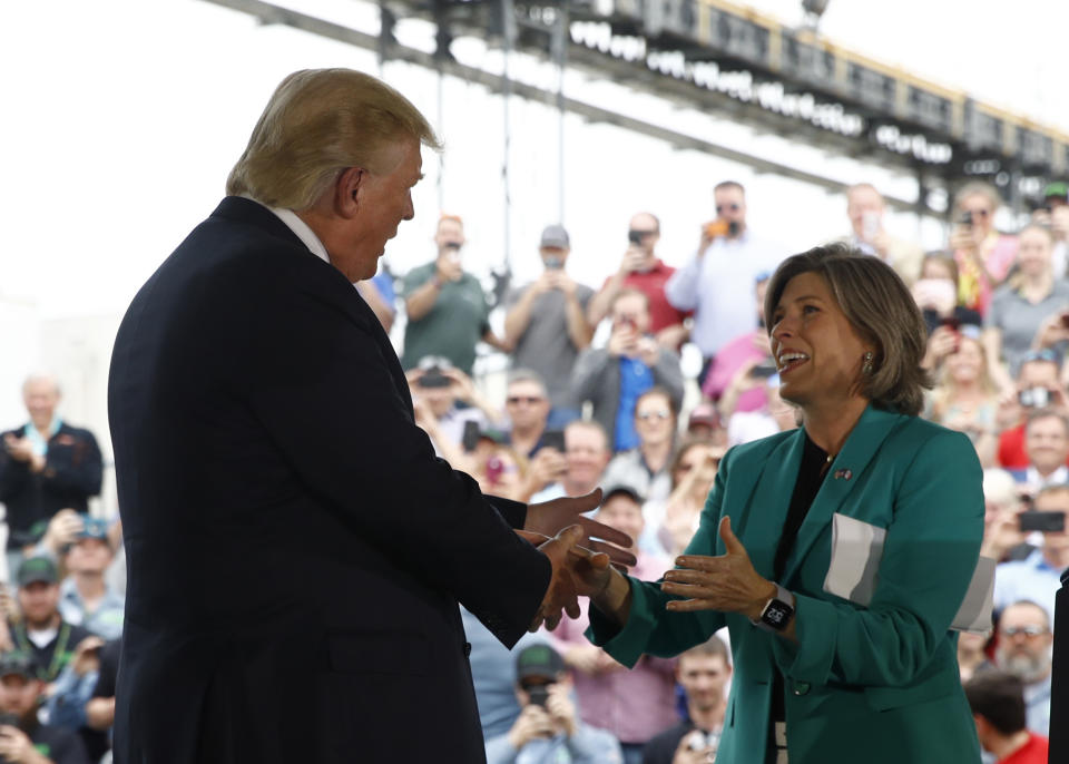 President Donald Trump greets Sen. Joni Ernst, R-Iowa, before he speaks at Southwest Iowa Renewable Energy in Council Bluffs, Iowa, Tuesday, June 11, 2019. (AP Photo/Patrick Semansky)