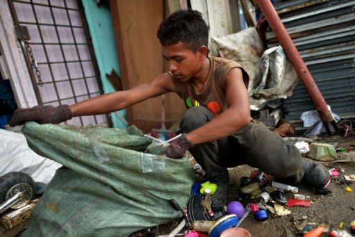 Myanmar ethnic Rohingya refugee Mohd Alam sorts out metal items to recycle in the suburbs of Kuala Lumpur. Myanmar's neighbours should prepare to accept refugees from the country's Rohingya minority who may try to flee abroad to escape bloody communal violence, refugee organisations say