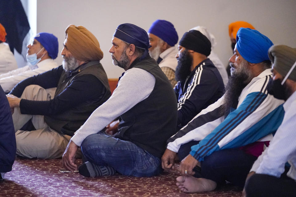 Members of the Sikh Coalition gather at the Sikh Satsang of Indianapolis in Indianapolis, Saturday, April 17, 2021 to formulate the groups response to the shooting at a FedEx facility in Indianapolis that claimed the lives of four members of the Sikh community. A gunman killed eight people and wounded several others before taking his own life in a late-night attack at a FedEx facility near the Indianapolis airport. (AP Photo/Michael Conroy)