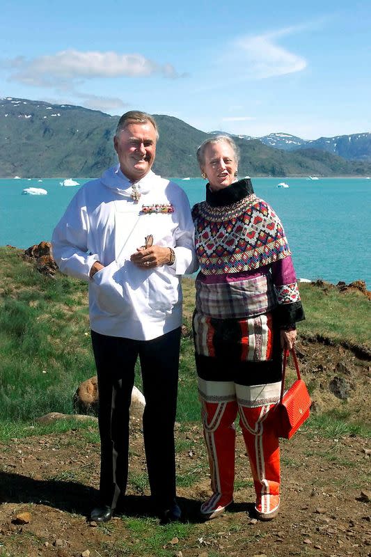 FILE PHOTO: Denmark's Queen Margrethe and Prince Henrik pose in traditional Greenlandic costumes in Greenland in 2000