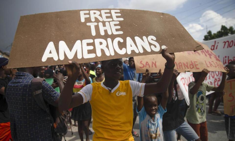 People protest for the release of kidnapped missionaries near the missionaries’ headquarters in Titanyen, north of Port-au-Prince, Haiti, on Tuesday, Oct. 19, 2021.