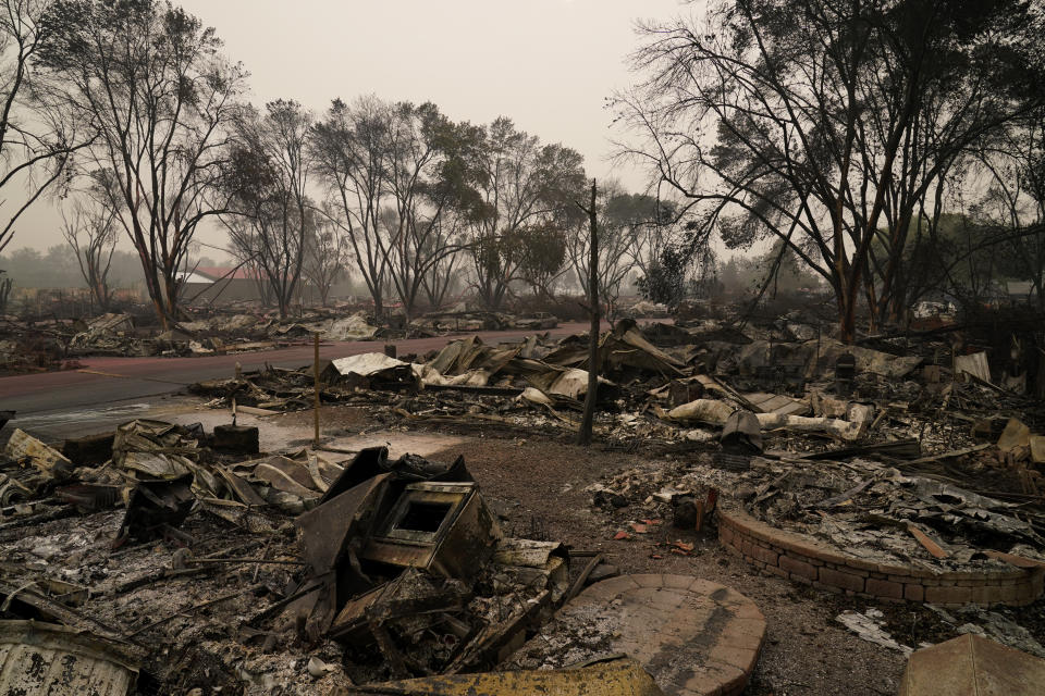Rubble remains from an area destroyed by the Almeda Fire, Friday, Sept. 11, 2020, in Talent, Ore. (AP Photo/John Locher)