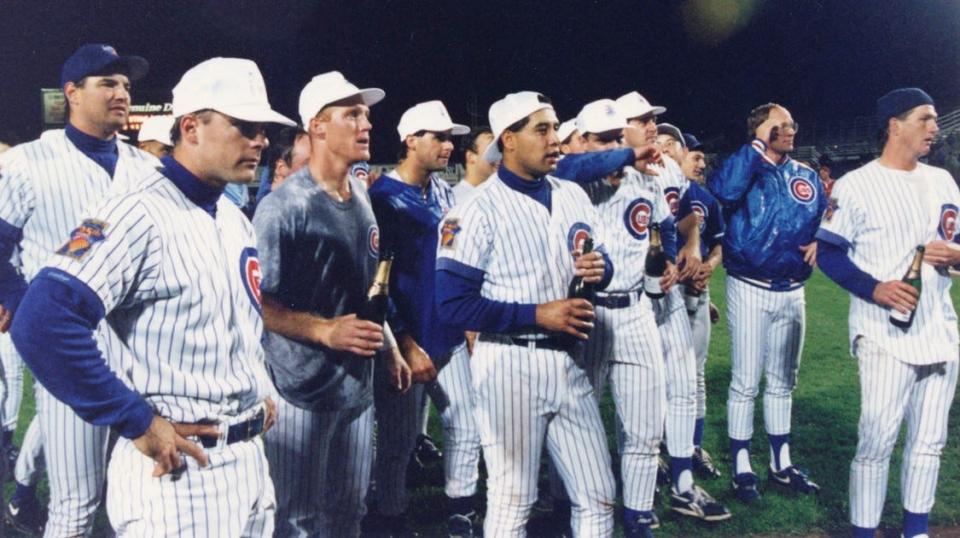 Members of the Iowa Cubs celebrate the 1993 title on the field at Sec Taylor Stadium.