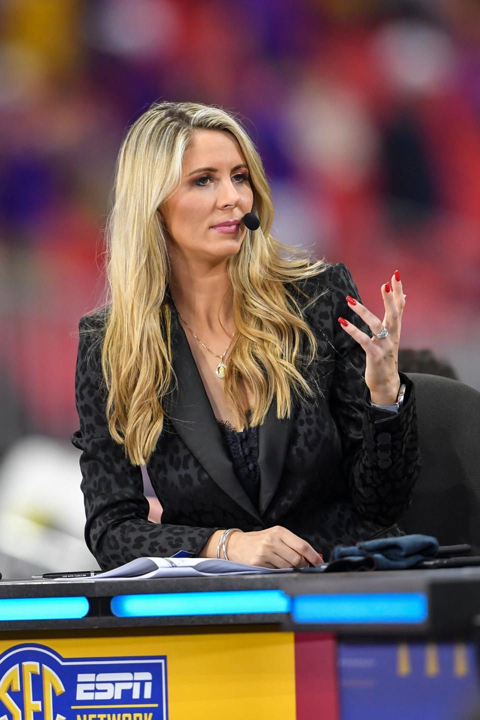 Dec 7, 2019; Atlanta, GA, USA; ESPN commentator Laura Rutledge works on set prior to the the 2019 SEC Championship Game between the Georgia Bulldogs and the LSU Tigers at Mercedes-Benz Stadium. Mandatory Credit: Dale Zanine-USA TODAY Sports