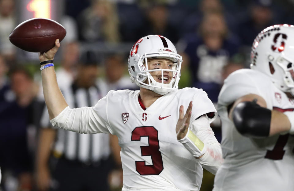 Stanford quarterback K.J. Costello throws during the first half of the team's NCAA college football game against Notre Dame, Saturday, Sept. 29, 2018, in South Bend, Ind. (AP Photo/Carlos Osorio)