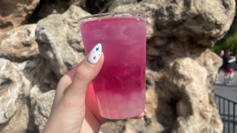 Glass cup with purple beverage