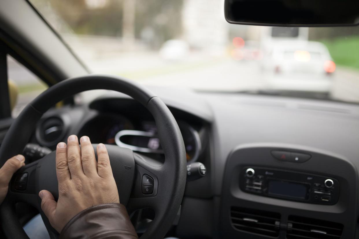 Driver hand on the horn in traffic