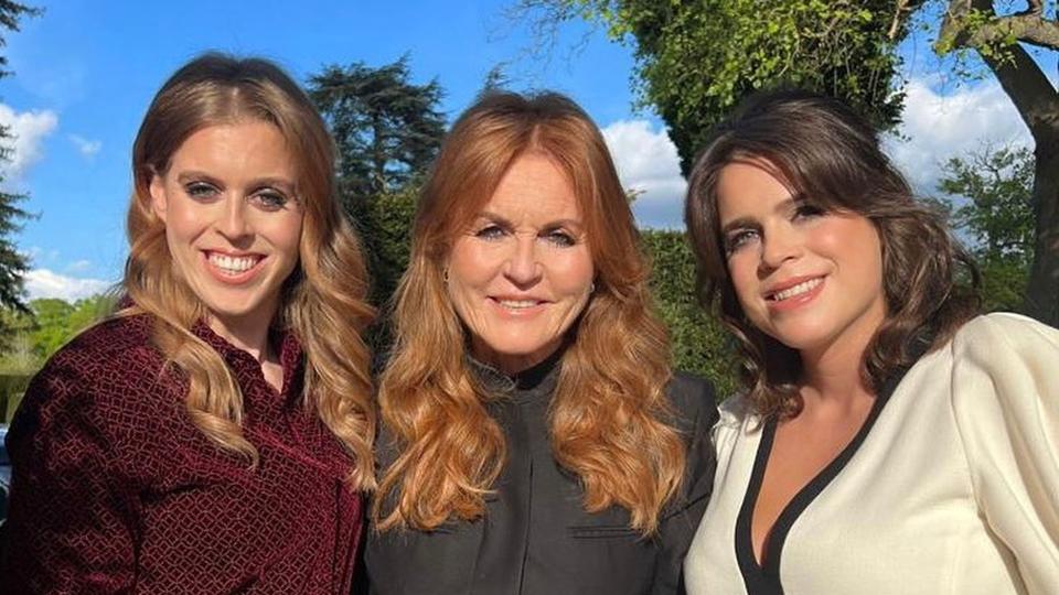 Sarah Ferguson posing with princess beatrice and princess eugenie