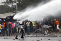 <p>A supporter of Kenyan opposition leader Raila Odinga is sprayed with water by police in Nairobi, Kenya, Nov. 17, 2017. (Photo: Baz Ratner/Reuters) </p>