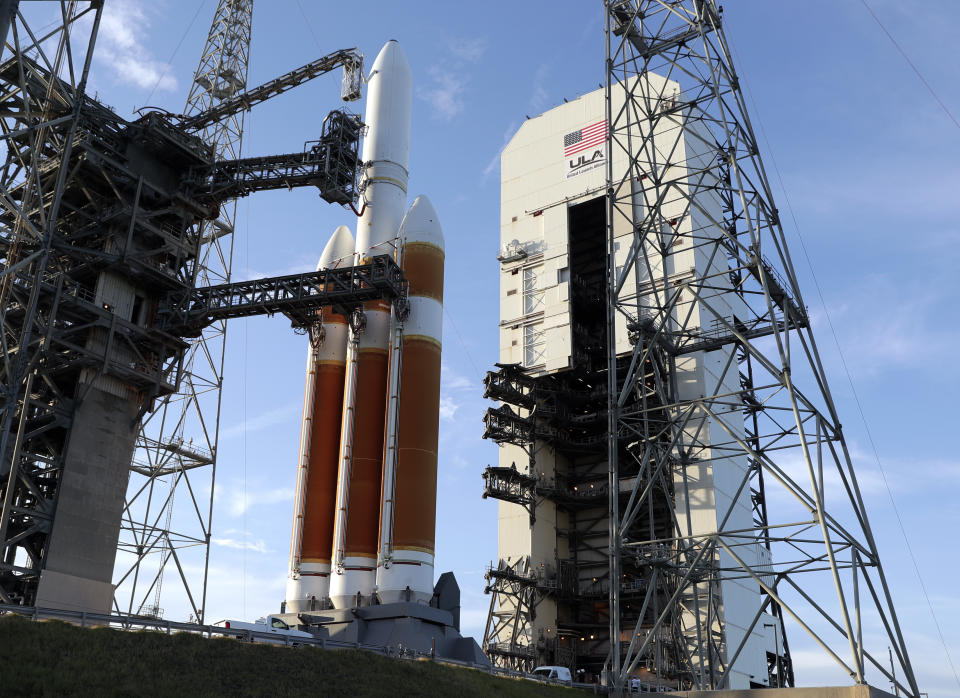 A Delta IV rocket stands ready for launch at complex 37 at the Kennedy Space Center, Friday, Aug. 10, 2018, in Cape Canaveral, Fla. The Parker Solar Probe, scheduled for lift off early Saturday morning, is protected by a first-of-its-kind heat shield and other innovative technologies that will provide unprecedented information about our Sun. (AP Photo/John Raoux)