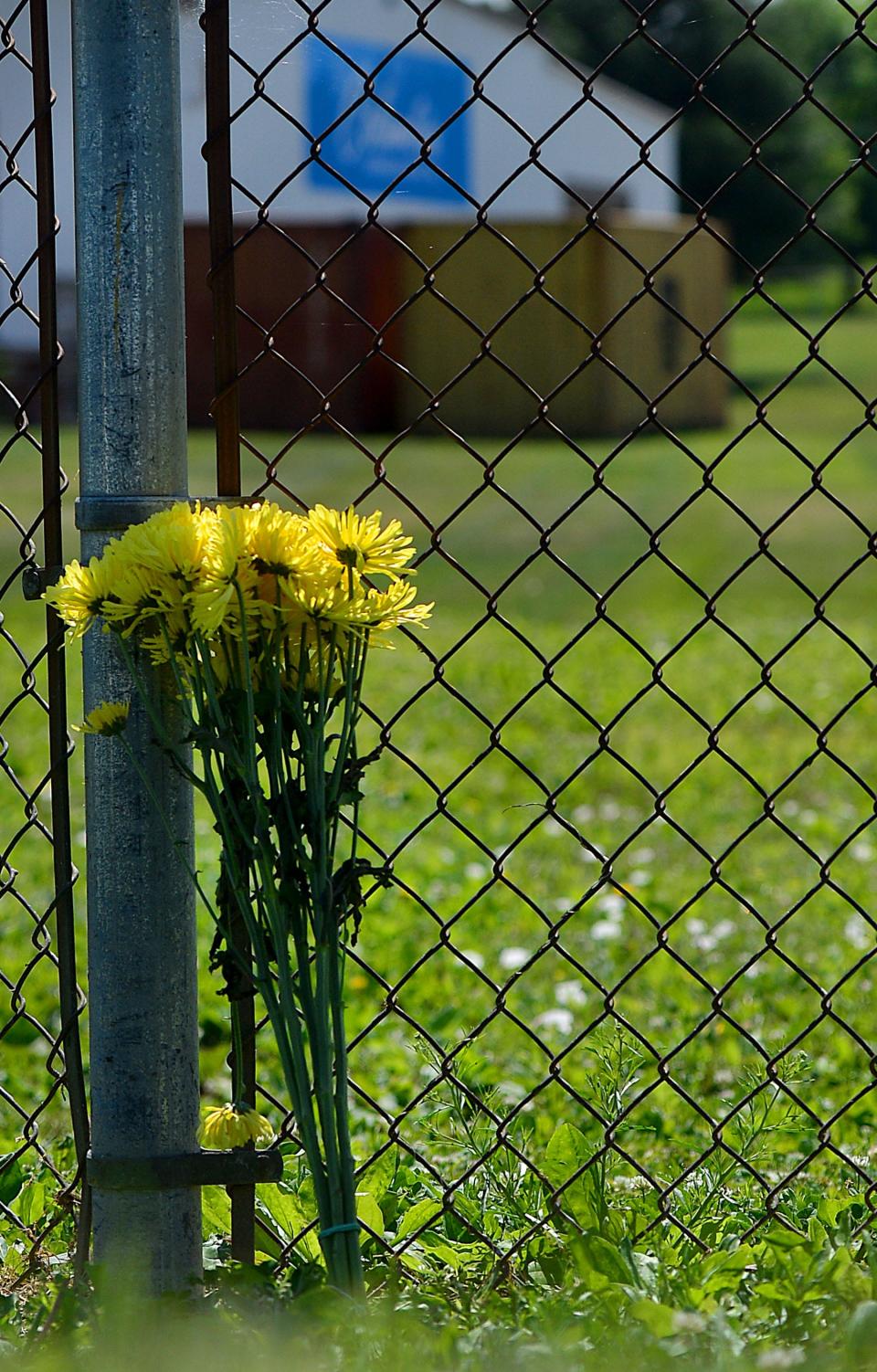 Flowers sit outside Columbia Machine near Smithsburg Friday,, a day after three people were killed and three injured, including the suspect,  in a mass shooting that started at the manufacturing company and ended on Mapleville Road.