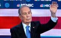 Former New York City Mayor Bloomberg raises his hand to speak during the ninth Democratic 2020 U.S. presidential debate at the Paris Theater in Las Vegas, Nevada, U.S.,