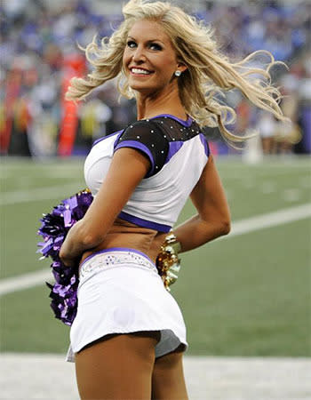 A Baltimore Ravens cheerleader performs in the first half of an NFL preseason football game against the San Francisco 49ers.