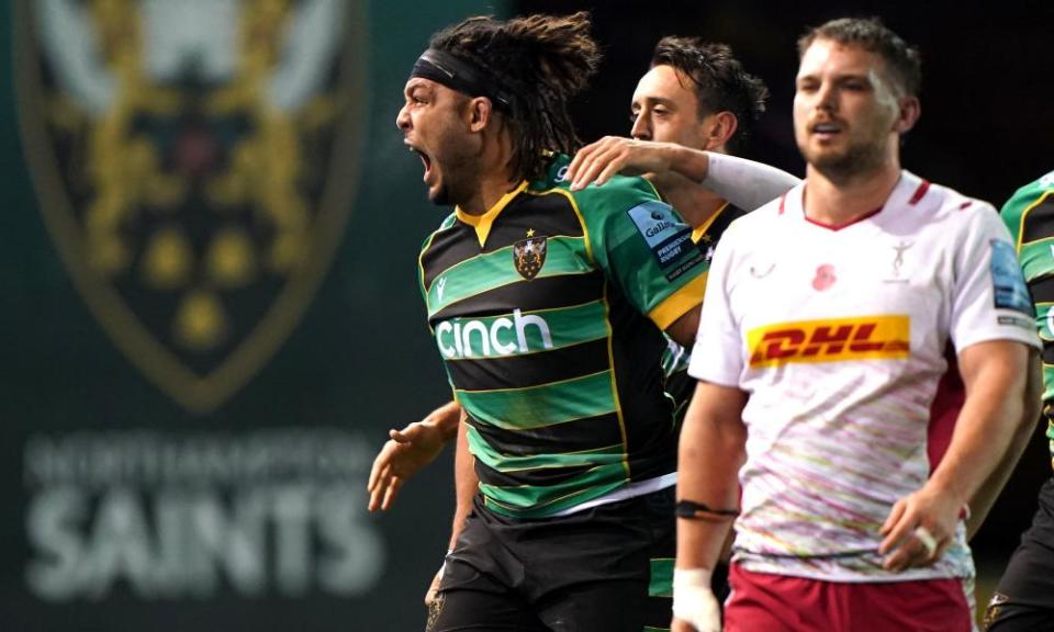 Northampton Saints' Lewis Ludlam (left) celebrates scoring his side's second try against Harlequins