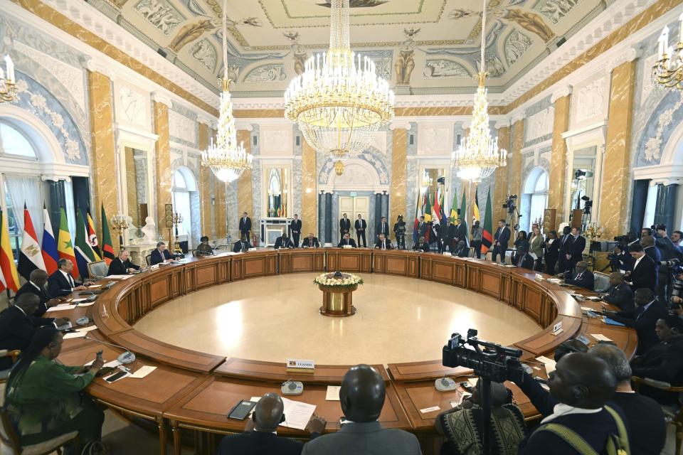 FILE - In this handout photo provided by Photo host Agency RIA Novosti, Russian President Vladimir Putin, at left, attends a meeting with a delegation of African leaders and senior officials in St. Petersburg, Russia, on June 17, 2023. On July 27-28, 2023 Russian President Vladimir Putin is hosting delegations from almost all of Africa's 54 countries at the second Russia-Africa Summit. (Pavel Bednyakov/Photo host Agency RIA Novosti via AP, File)