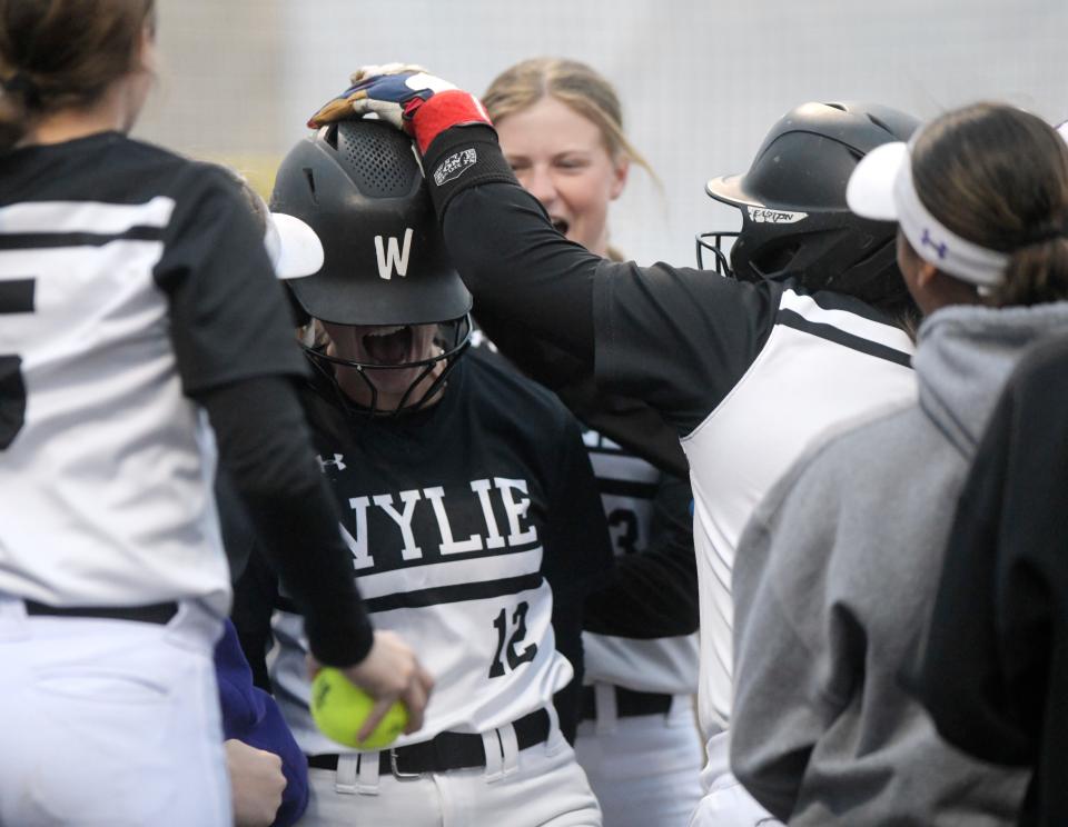 Abilene Wylie's Halli Russell celebrates her home run against Lubbock-Cooper in a District 4-5A softball game, Friday, April 19, 2024, at First United Park in Woodrow.