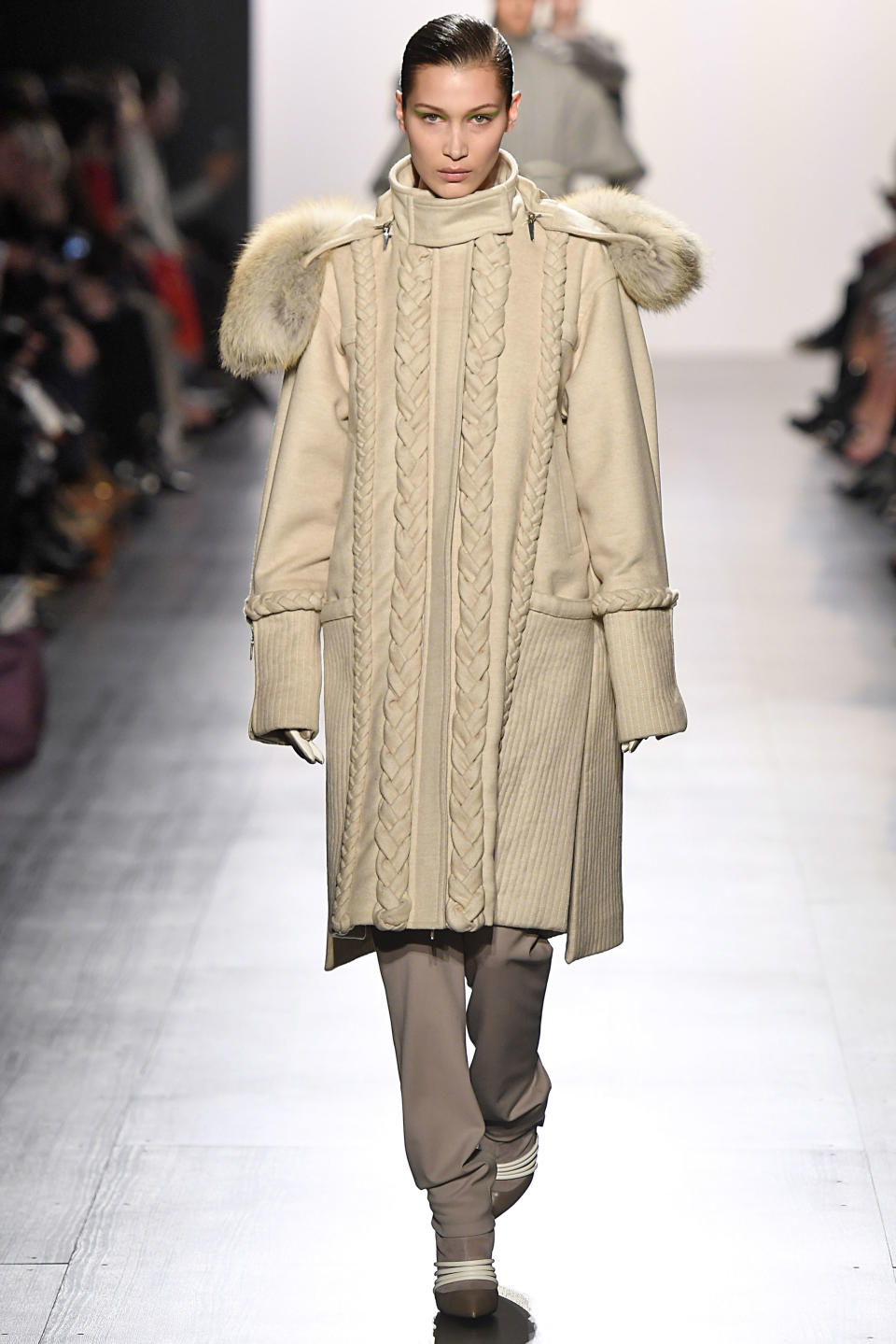 <p>Hadid wore a cream oversized coat at Gurung's AW17 runway collection at NYFW</p>