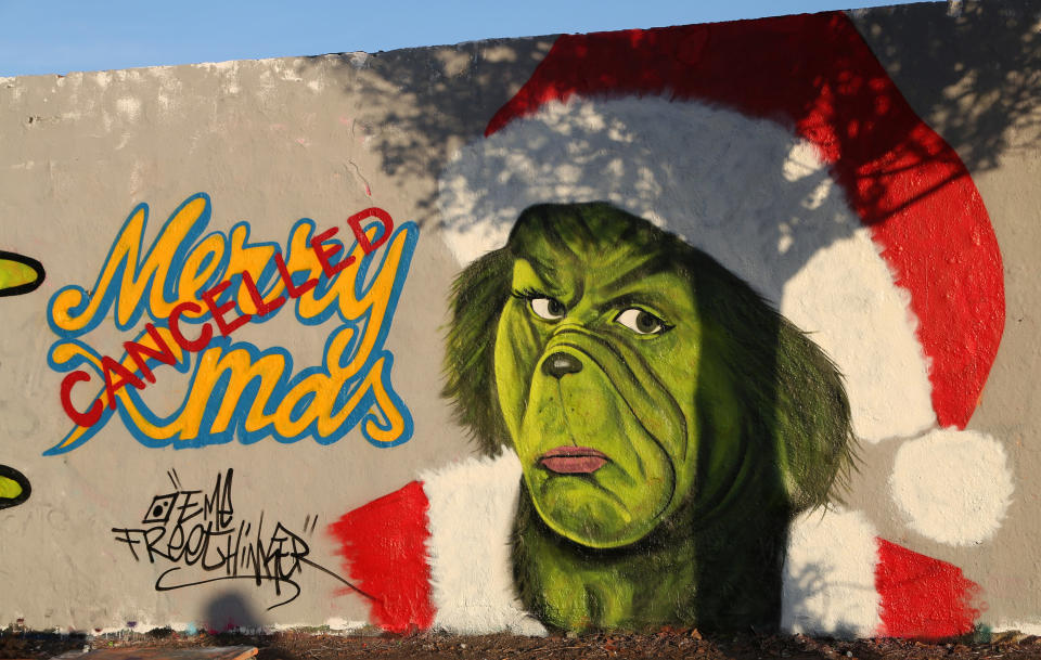 A graffiti drawing of the Grinch on a wall