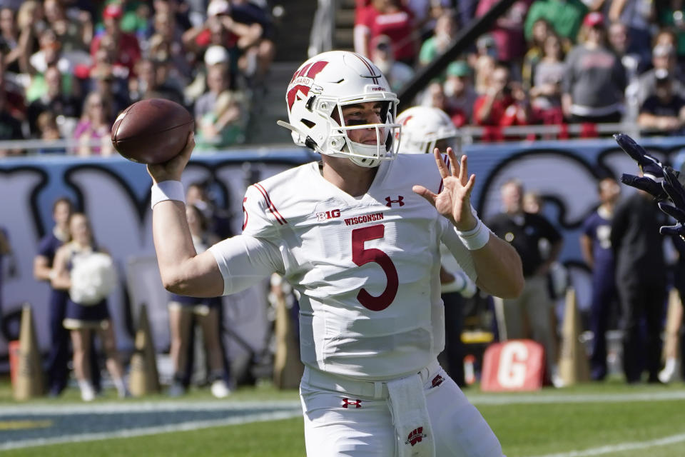 Wisconsin quarterback Graham Mertz passes during the first half of an NCAA college football game against Notre Dame Saturday, Sept. 25, 2021, in Chicago. (AP Photo/Charles Rex Arbogast)