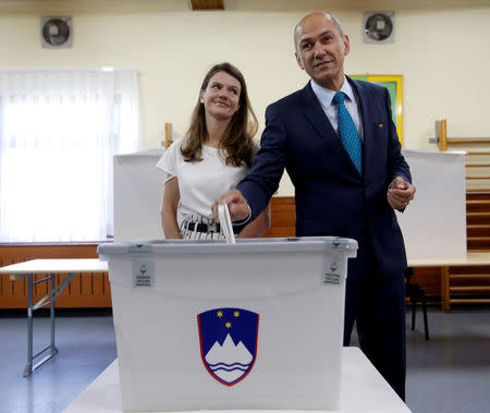 Janez Jansa, leader of the Slovenian Democratic Party (SDS), and his wife Urska cast their votes at a polling station during the general election in Velenje, Slovenia, June 3, 2018. REUTERS/Borut Zivulovic