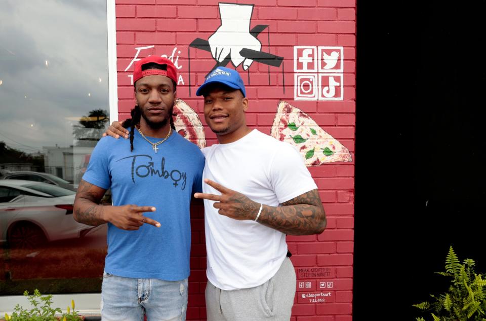 Jordan Dailey, left, with his brother David Montgomery, the new Lions running back, outside of Fredi's The PizzaMan in Melvindale on Friday, June 16, 2023.