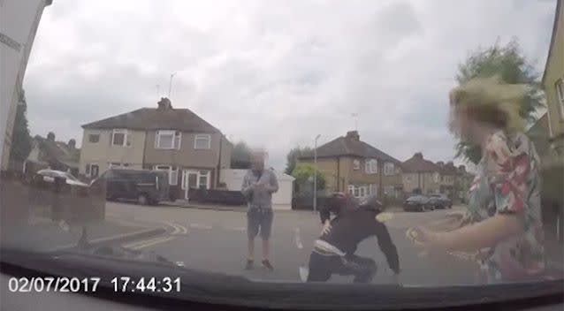 The seemingly injured man clutched at his back as the driver emerged on screen. Source: Facebook