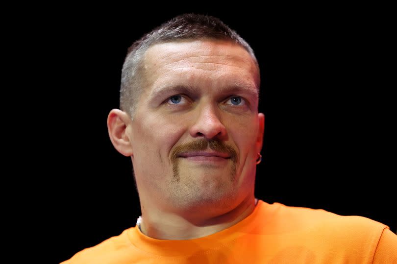 Oleksandr Usyk looks on