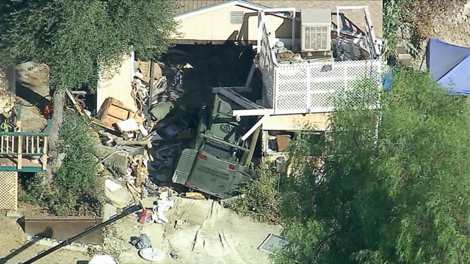 PHOTO: Police used an armored vehicle with a hydraulic battering ram to tear down a home on Keissel Road as they searched for missing couple, Stephanie Menard, 73, and her husband, Daniel, 79 in Redlands, Calif. (KABC)