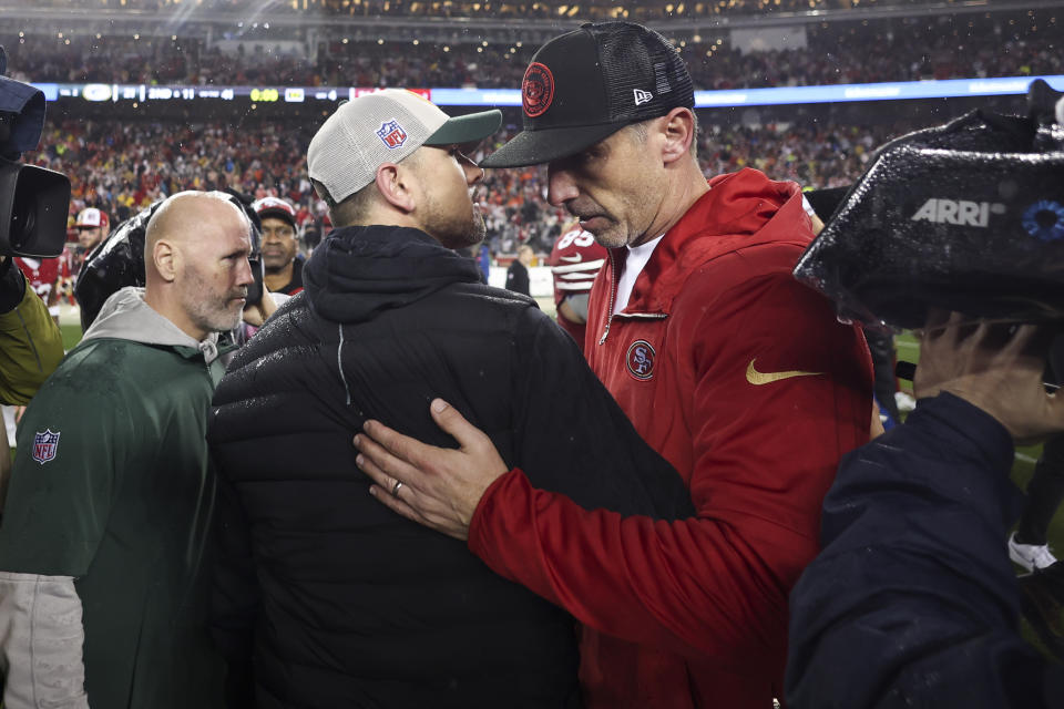 San Francisco 49ers head coach Kyle Shanahan , right, hugs Green Bay Packers head coach Matt LaFleur after an NFL football NFC divisional playoff game Saturday, Jan. 20, 2024, in Santa Clara, Calif. (AP Photo/Jed Jacobsohn)