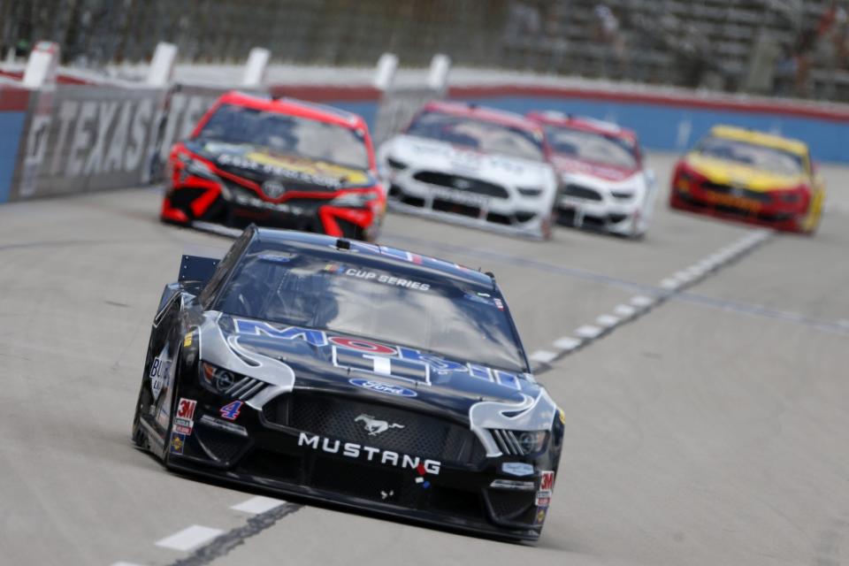 FORT WORTH, TEXAS - JULY 19: Kevin Harvick, driver of the #4 Mobil 1 Ford, leads a pack of cars during the NASCAR Cup Series O\