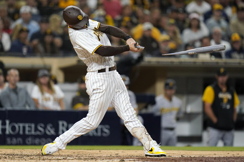 San Diego Padres' Wil Myers breaks his bat as he hits an RBI single against the Pittsburgh Pirates during the eighth inning of a baseball game Friday, May 27, 2022, in San Diego. (AP Photo/Gregory Bull)