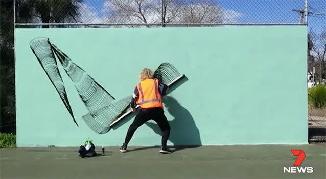 The artist had just finished an unauthorised mural at the Yarraville Tennis Club. Source: 7 News