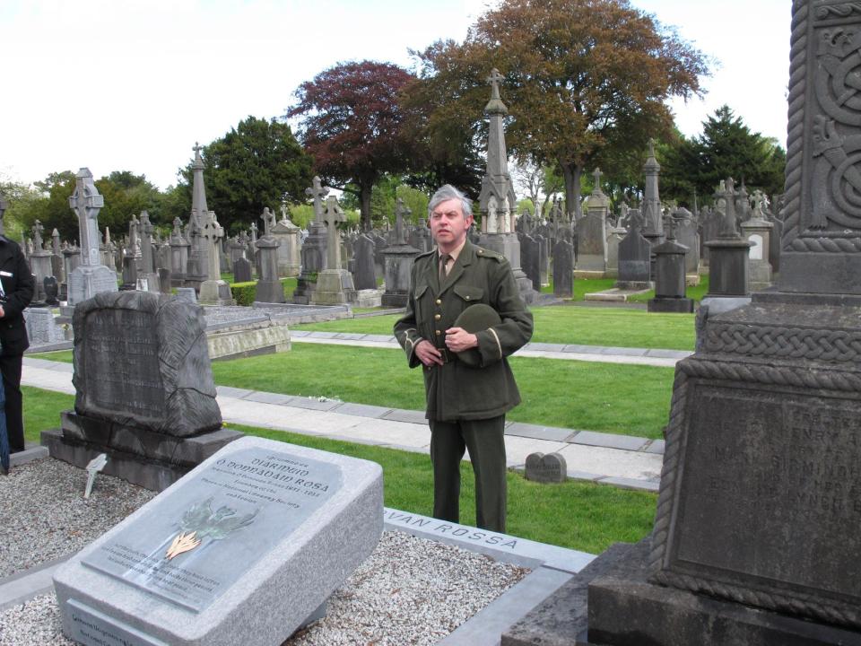 This May 13, 2013 photo shows an actor re-enacting Padraig Pearse's famous oration at the grave of Fenian Jeremiah O'Donovan Rossa, who died in 1915. The oration fueled Irish Republican sentiment which led to the Easter Rising a year later. The reenactment is part of a guided walking tour of the cemetery, which is hosting events related to The Gathering, a yearlong initiative to bring Irish emigrants and their descendants back to Ireland to celebrate their heritage. (AP Photo/Helen O'Neill)