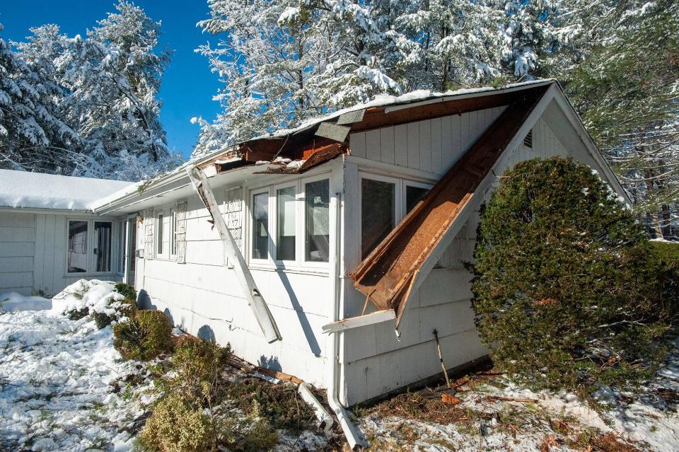 This home at 13 Tartufi Circle in Framingham was damaged during last weekend's snowstorm after a tree had fallen onto the house, Jan. 8, 2024. The tree has since been removed.