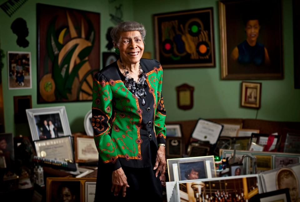 041312 (Richard Graulich/The Palm Beach Post) West Palm Beach - Ineria Hudnell, 91, stands with artwork and black history memorabilia inside her West Palm Beach home Friday.  She is receiving Urban League of Palm Beach County award next week for her work on recording and preserving Black history in this area.