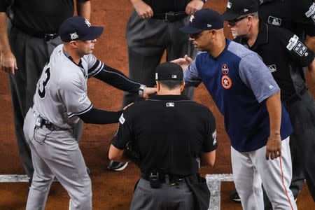 FILE PHOTO - Oct 20, 2017; Houston, TX, USA; New York Yankees third base coach Joe Espada (53) meets with Houston Astros bench coach Alex Cora (26) before game six of the 2017 ALCS playoff baseball series at Minute Maid Park. Mandatory Credit: Shanna Lockwood-USA TODAY Sports